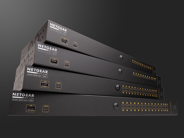Four Q-SYS NS Series Gen 2 network switches stacked on top of each other